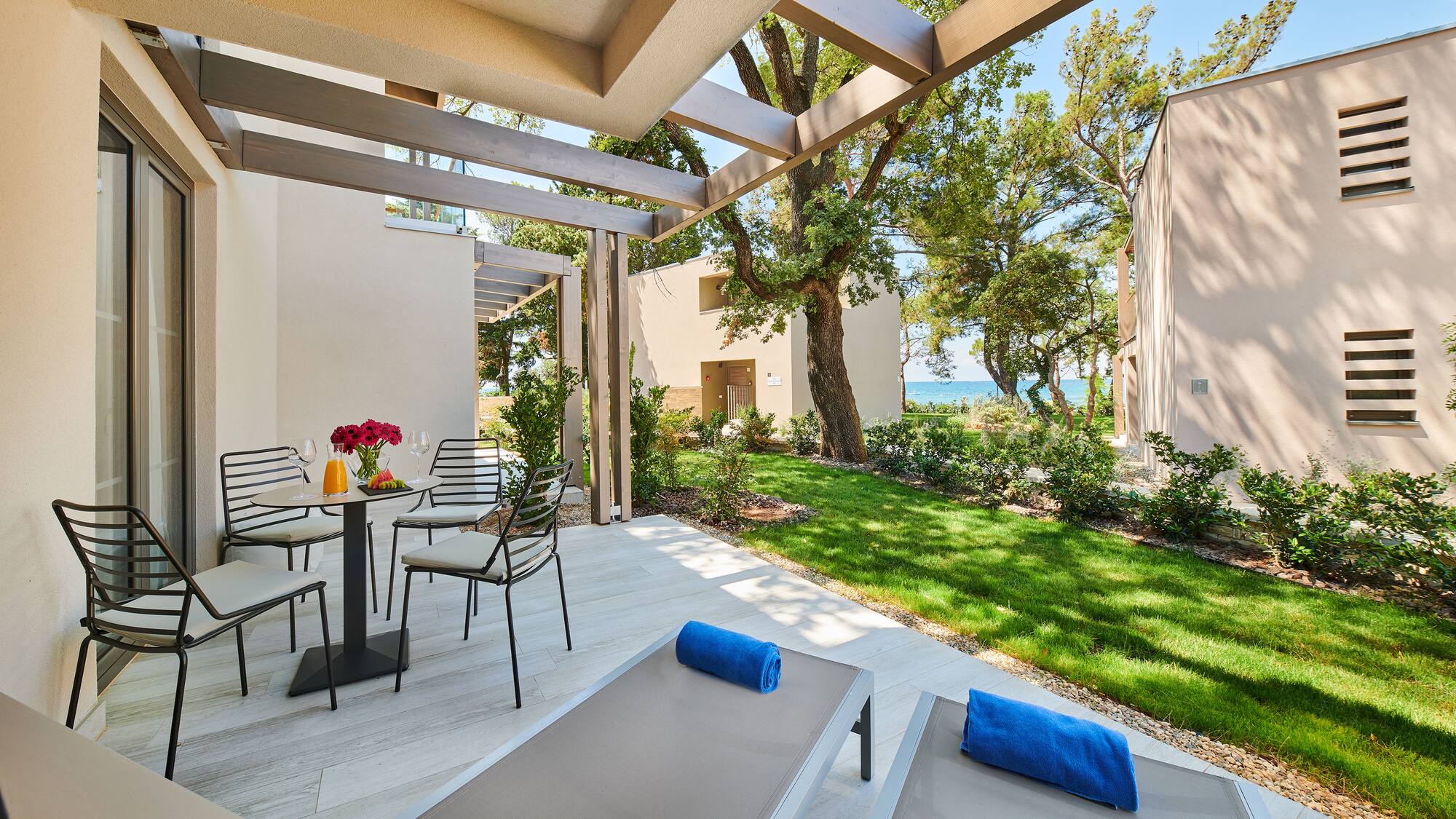 a patio with chairs and a table