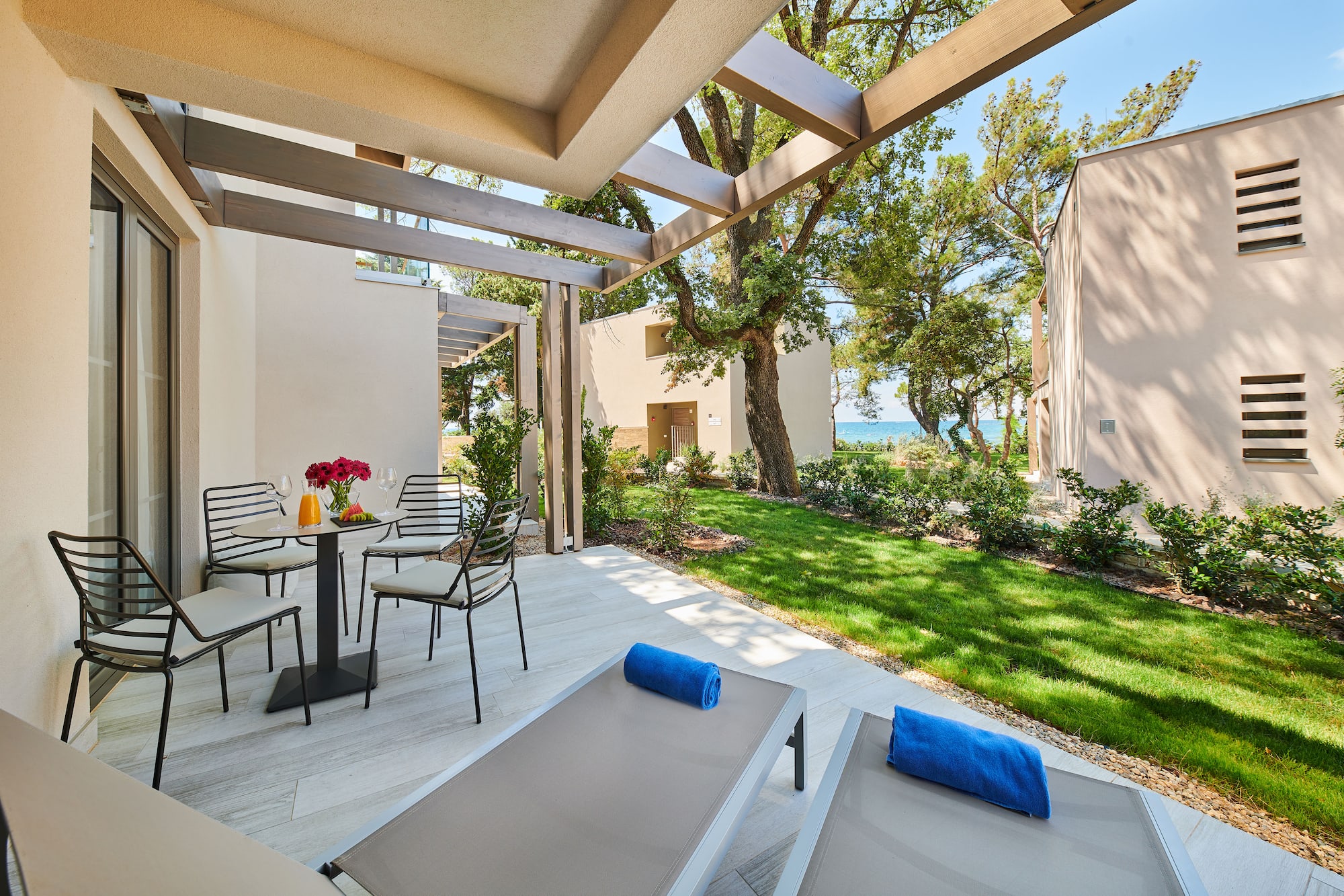 a patio with chairs and a table