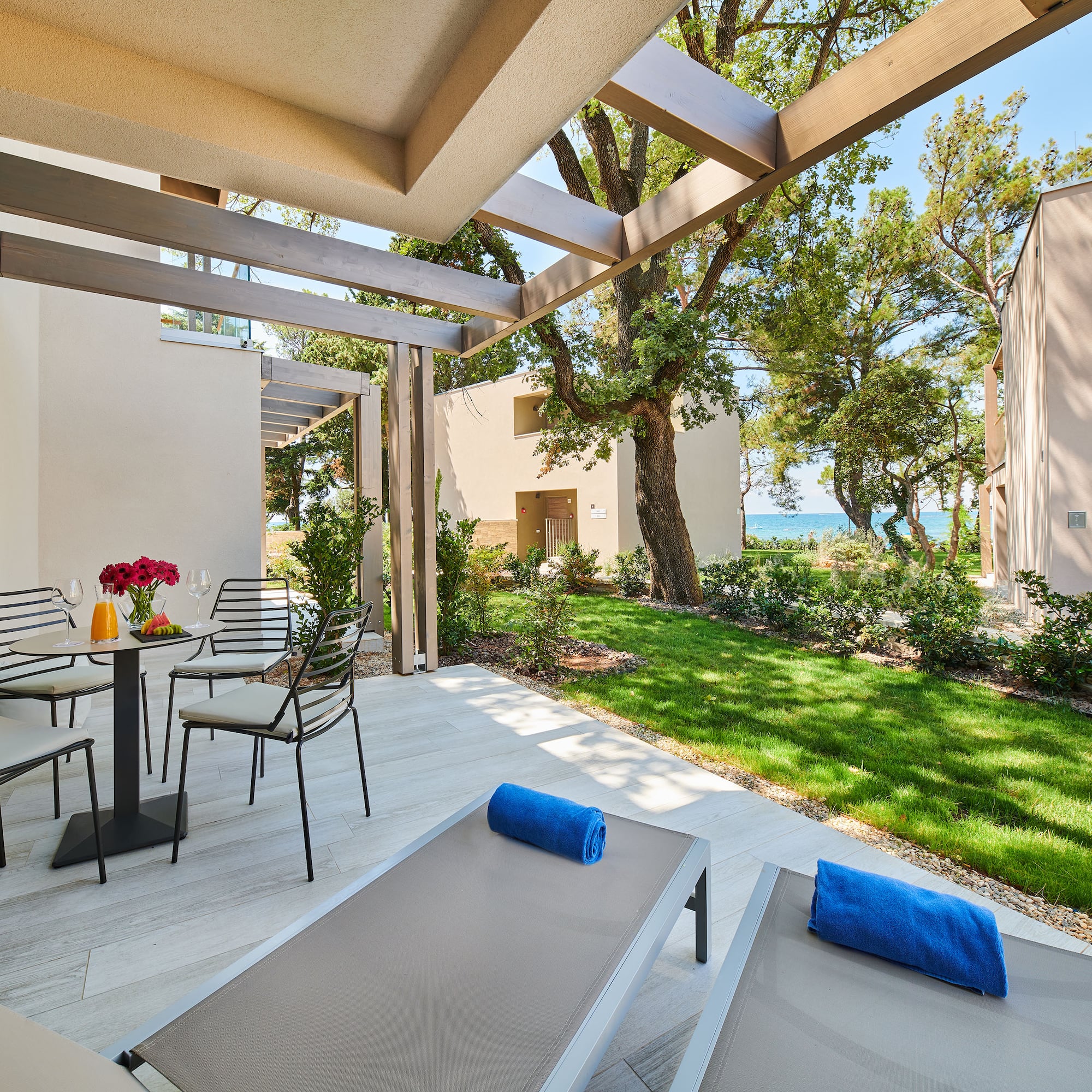 a patio with chairs and a table