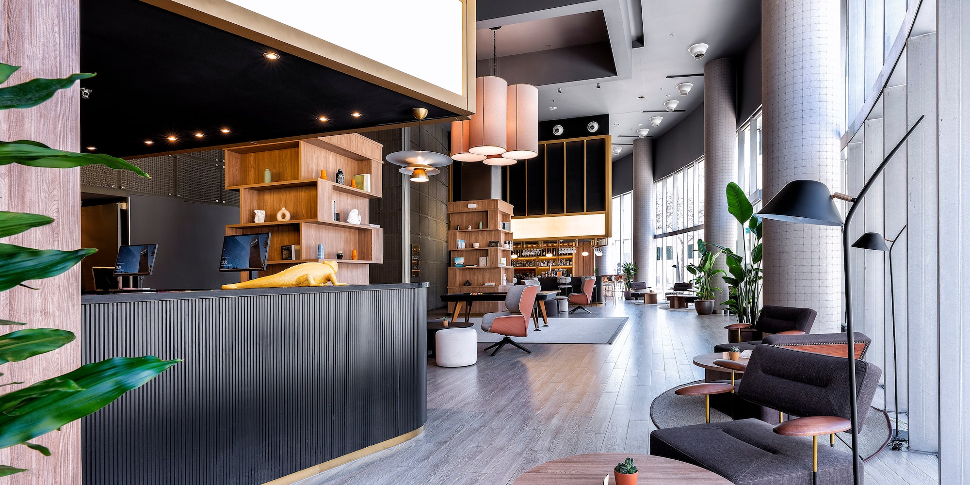 a lobby with a reception desk and chairs