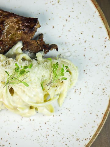 a plate of food on a wood table