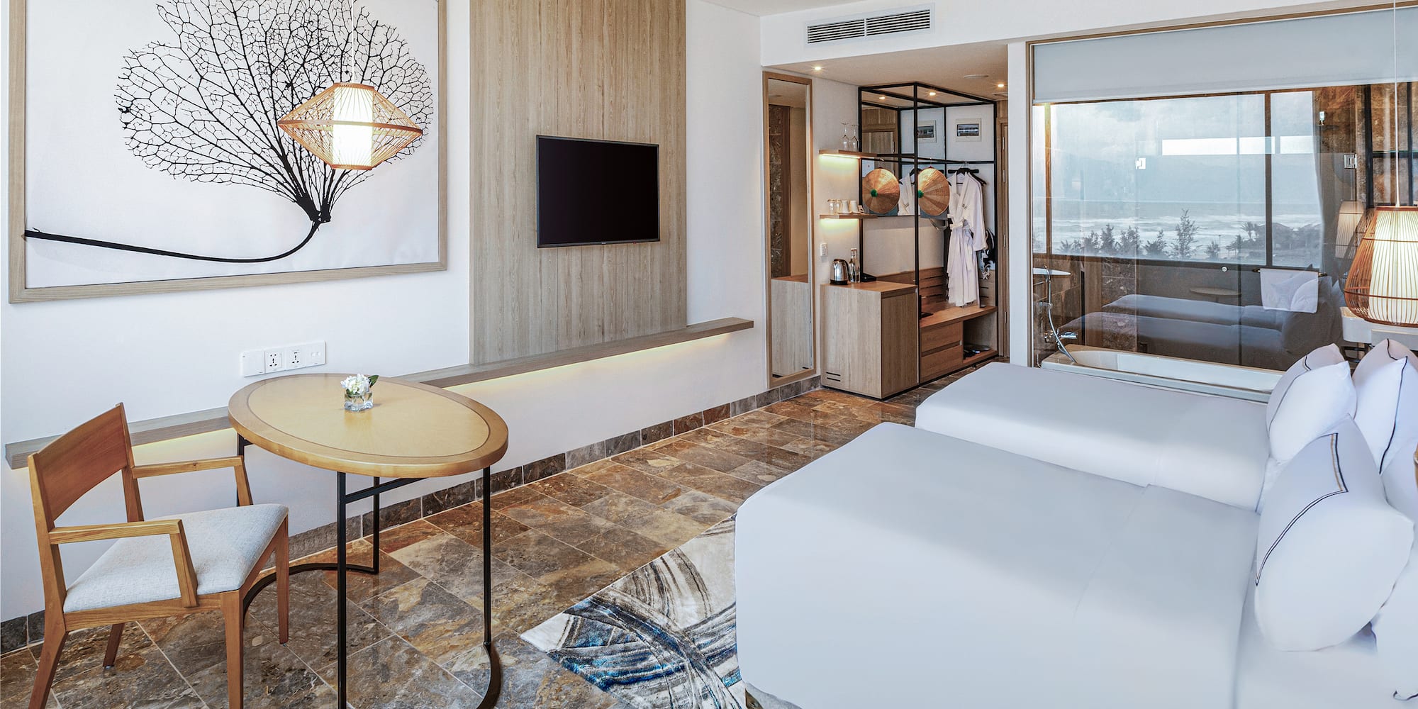 a room with two beds and a table