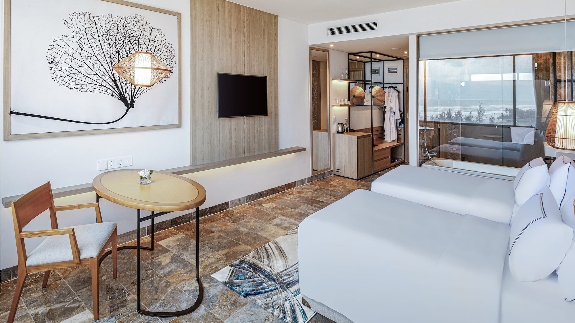 a room with two beds and a table