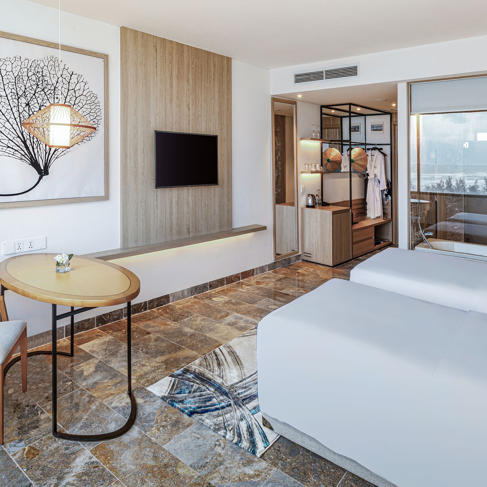 a room with two beds and a table