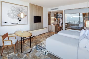 a room with two beds and a table