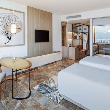 a room with two beds and a table