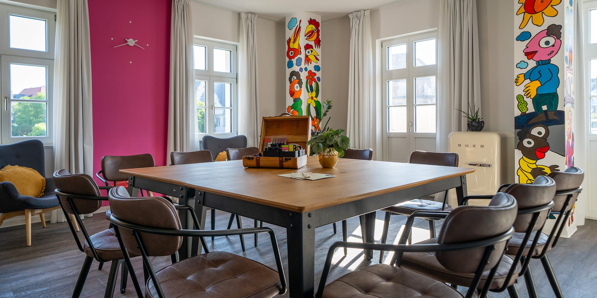 a room with a table and chairs