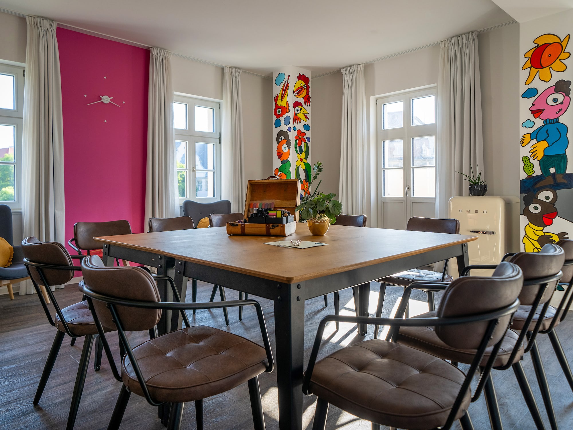 a room with a table and chairs