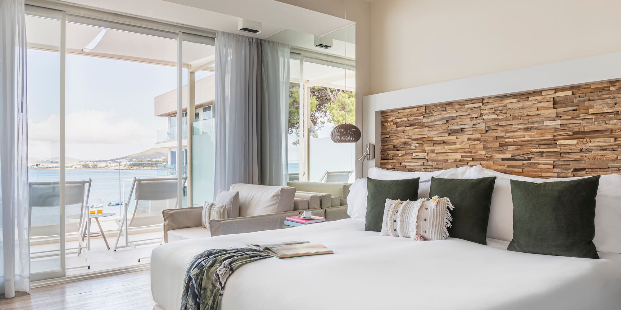 a room with a bed and a large window