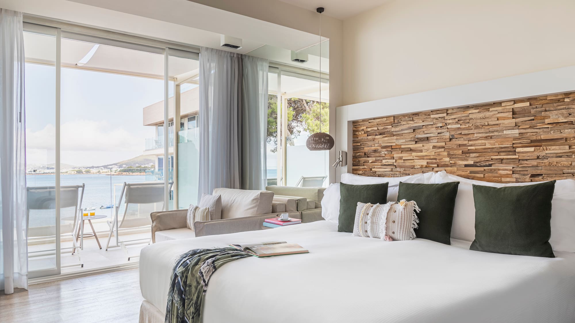 a room with a bed and a large window