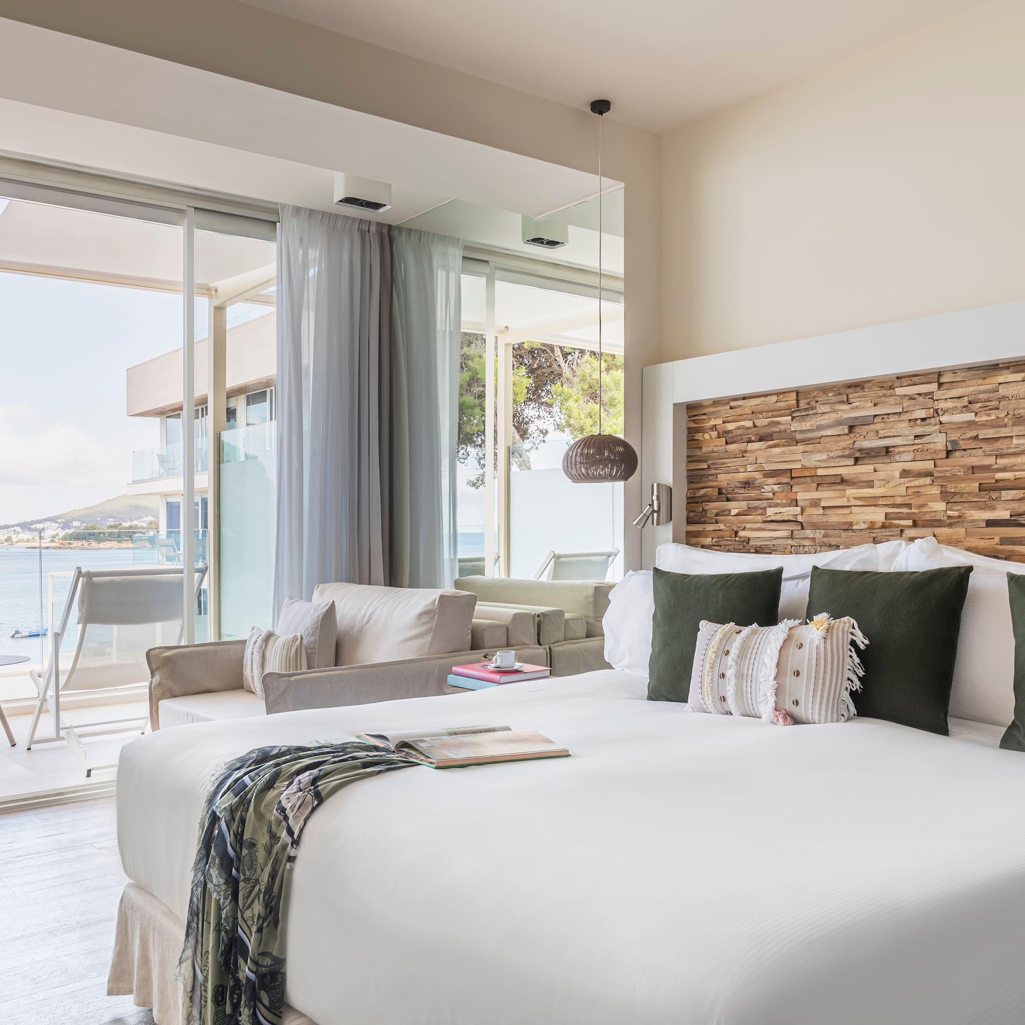 a room with a bed and a large window