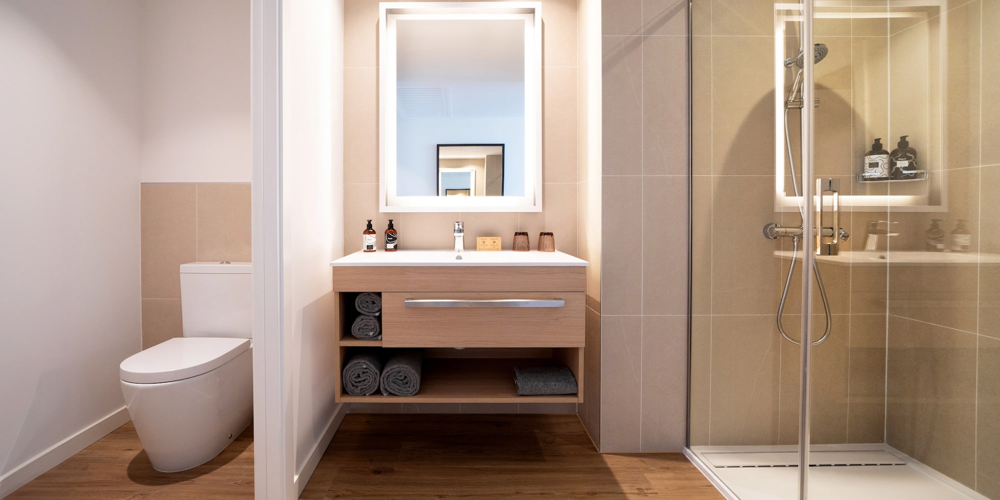 a bathroom with a mirror and a toilet