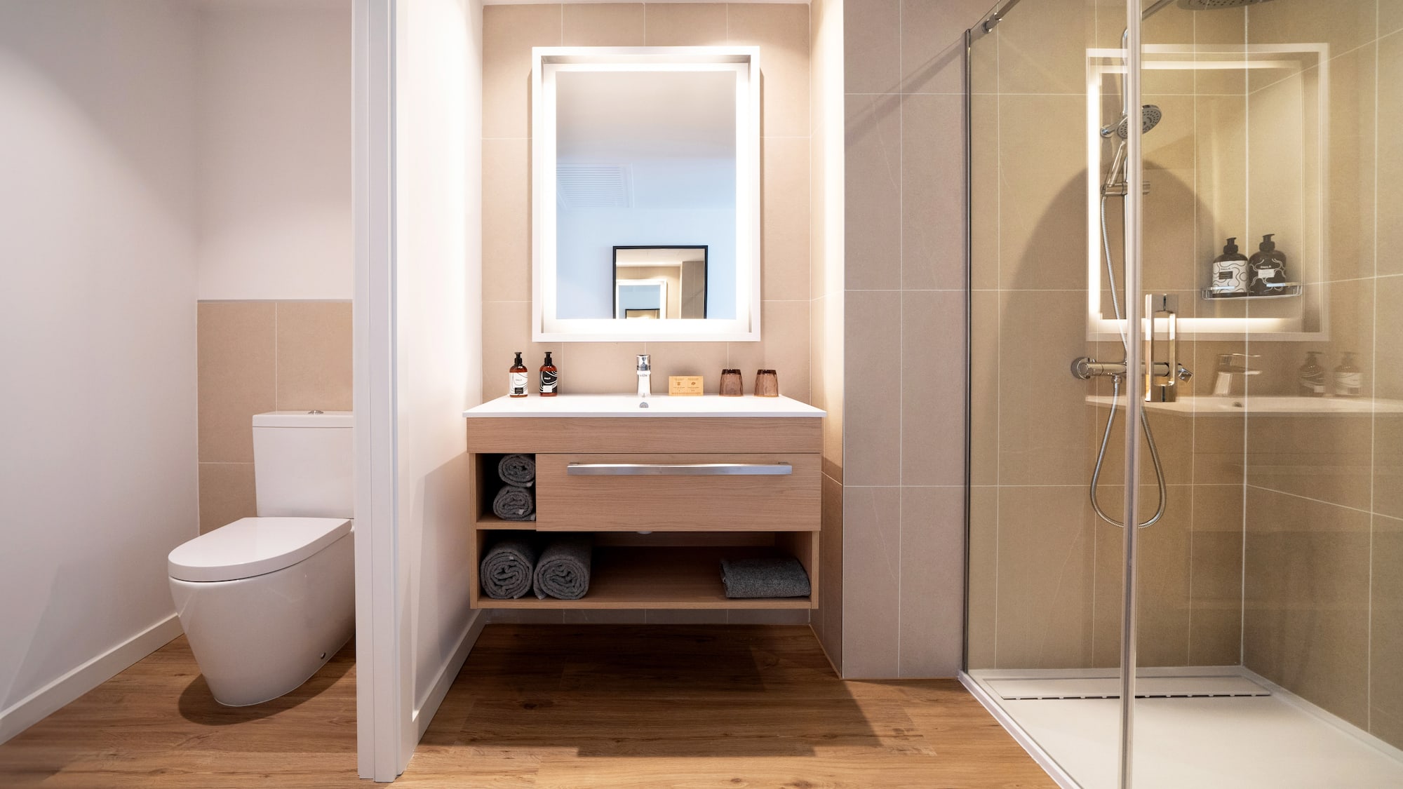 a bathroom with a mirror and a toilet