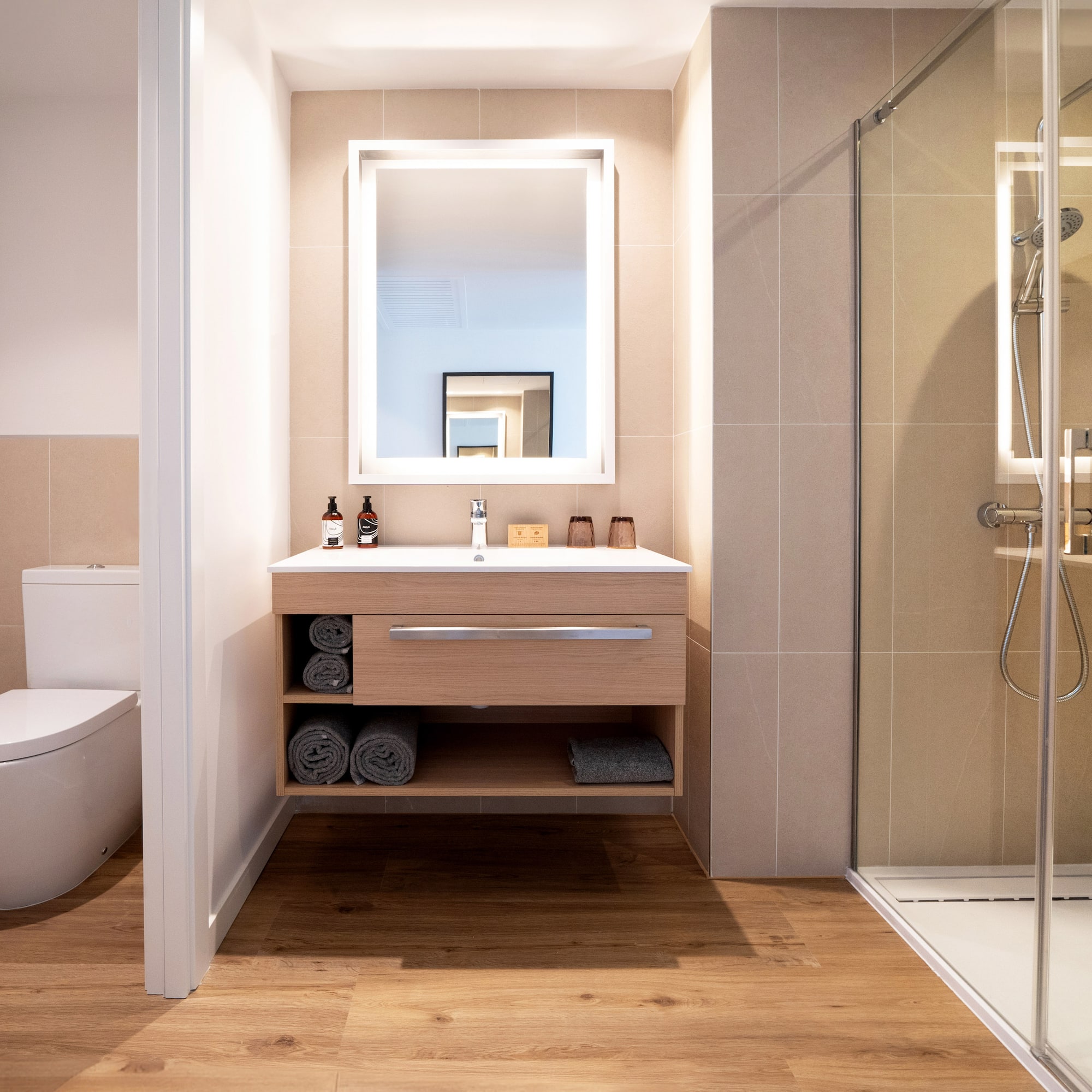 a bathroom with a mirror and a toilet