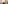 Modern bathroom with wood vanity, lighted mirror, walk-in shower, and toilet.