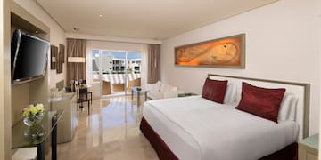 a bedroom with a bed and a table