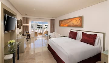 a bedroom with a bed and a table