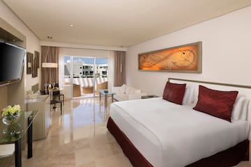 a bedroom with a bed and a table