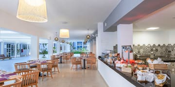 a restaurant with tables and chairs