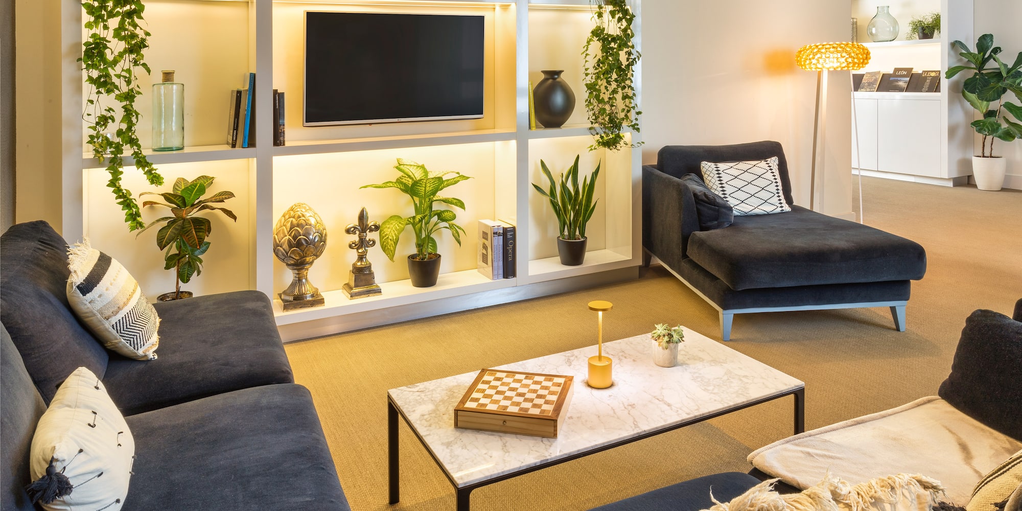 a living room with a tv and couches