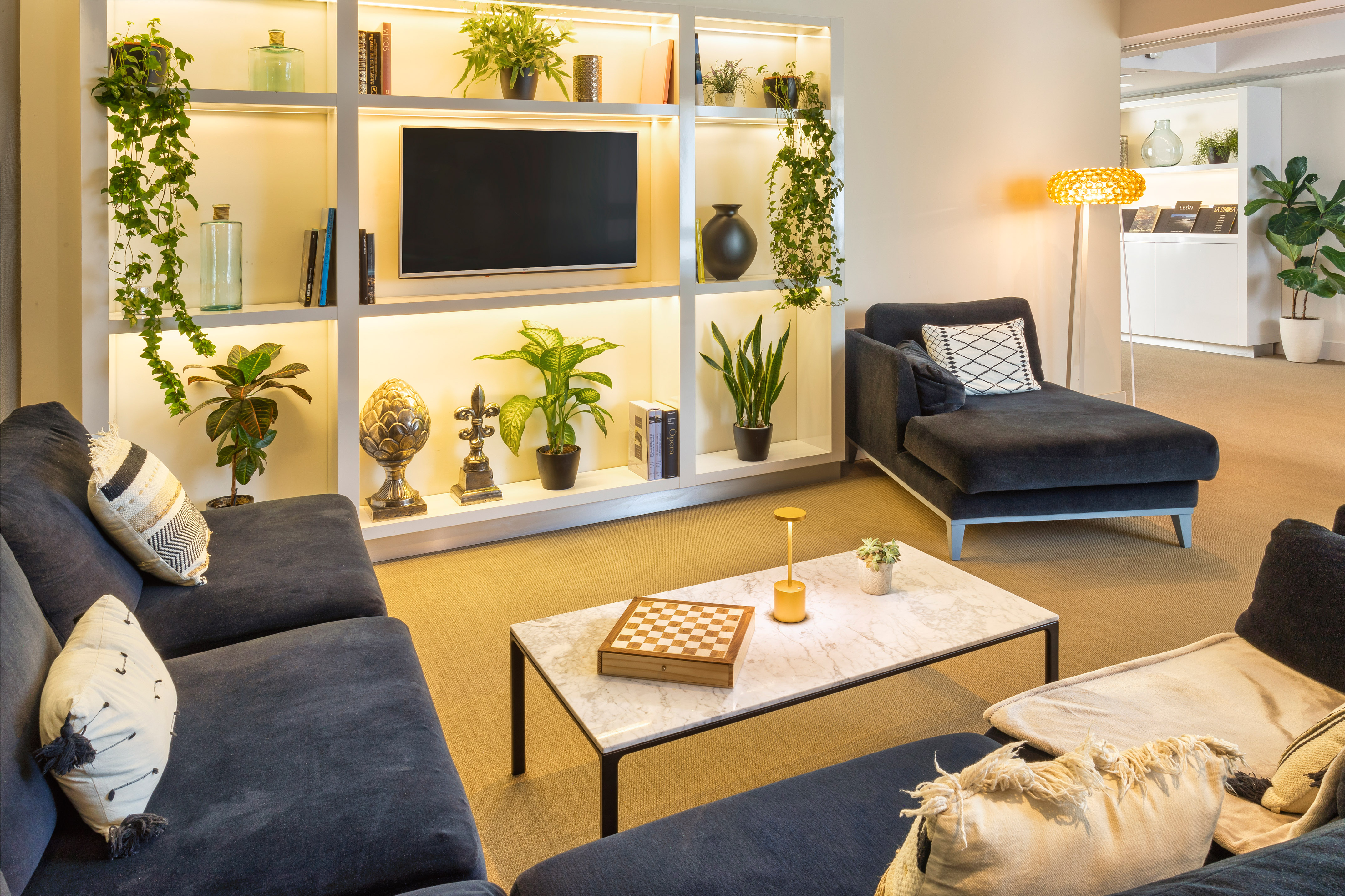 a living room with a tv and couches