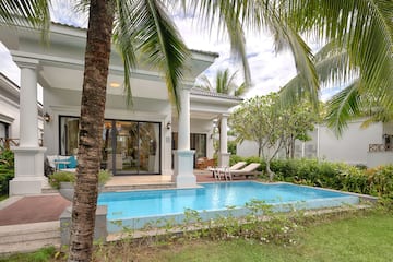 a pool in front of a house