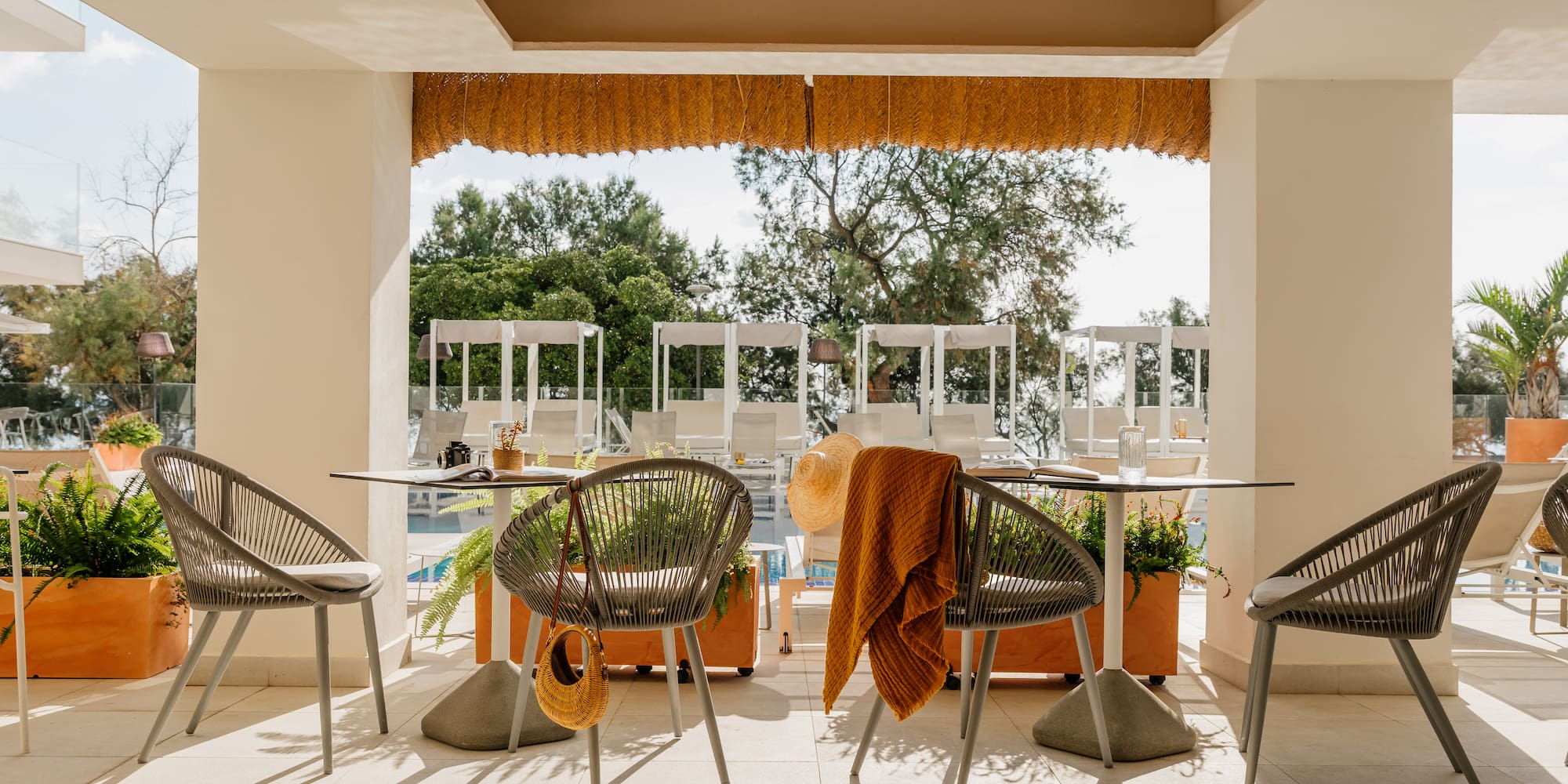 a patio with chairs and tables