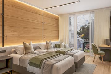 a room with two beds and a table