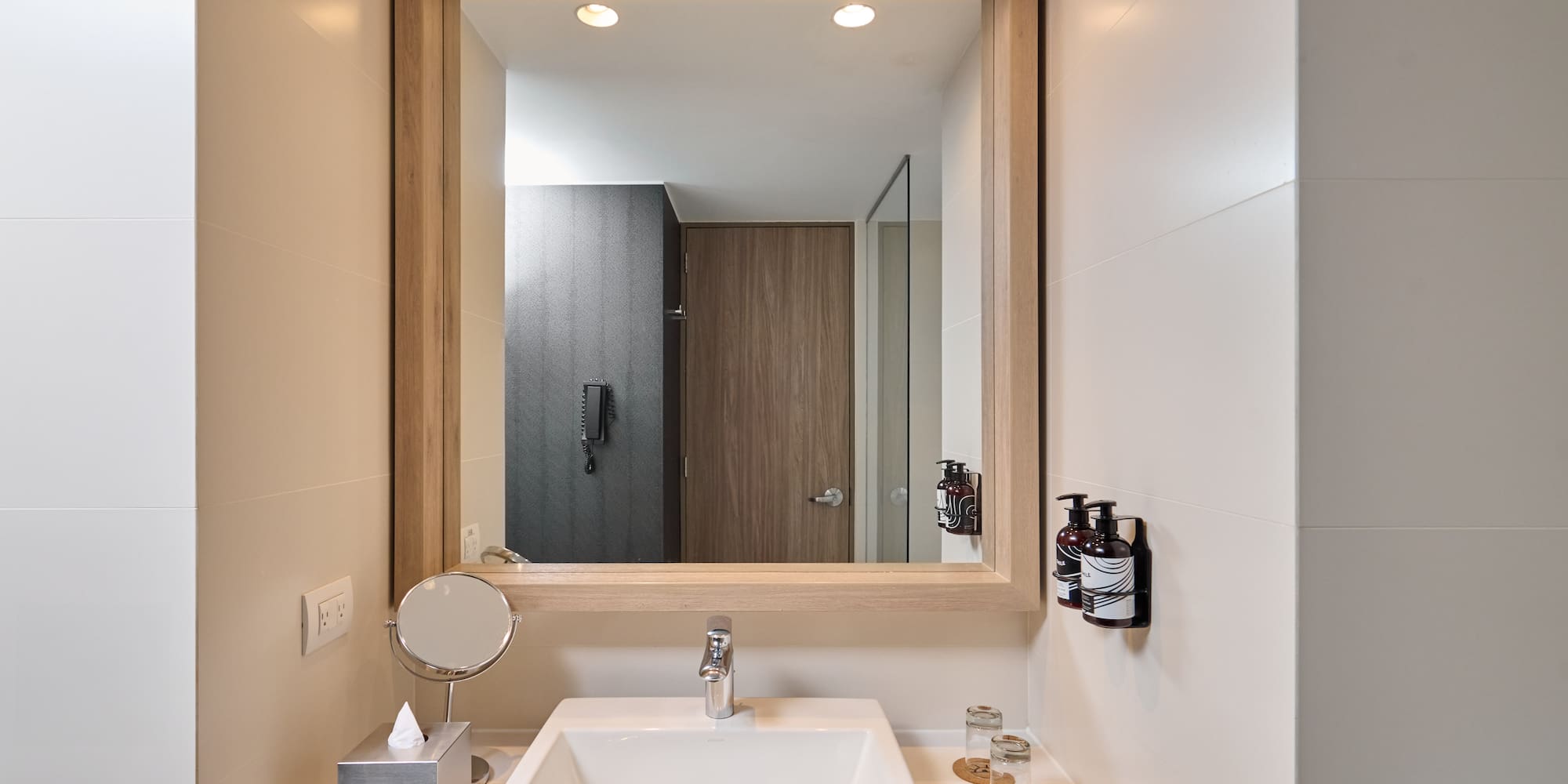 a mirror above a sink