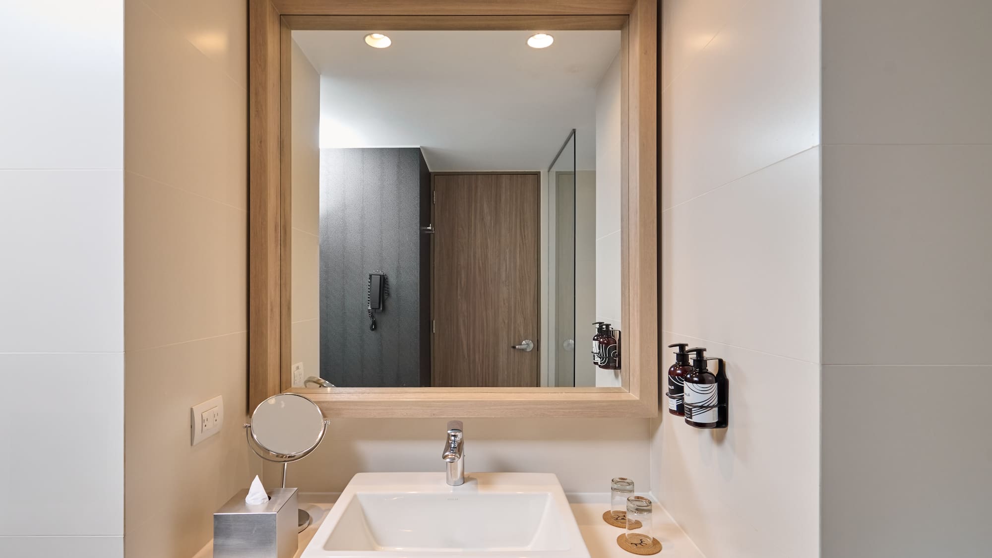 a mirror above a sink