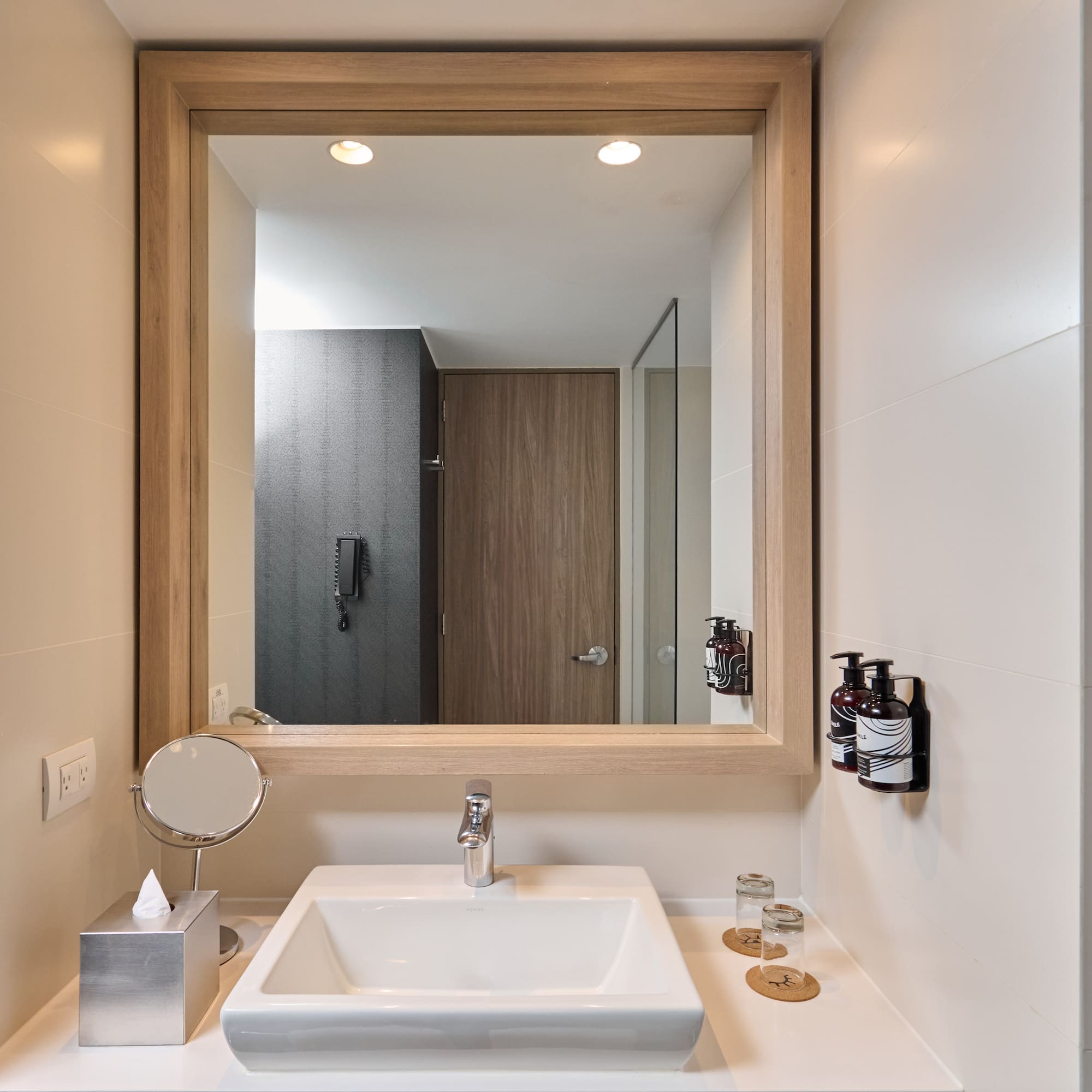 a mirror above a sink