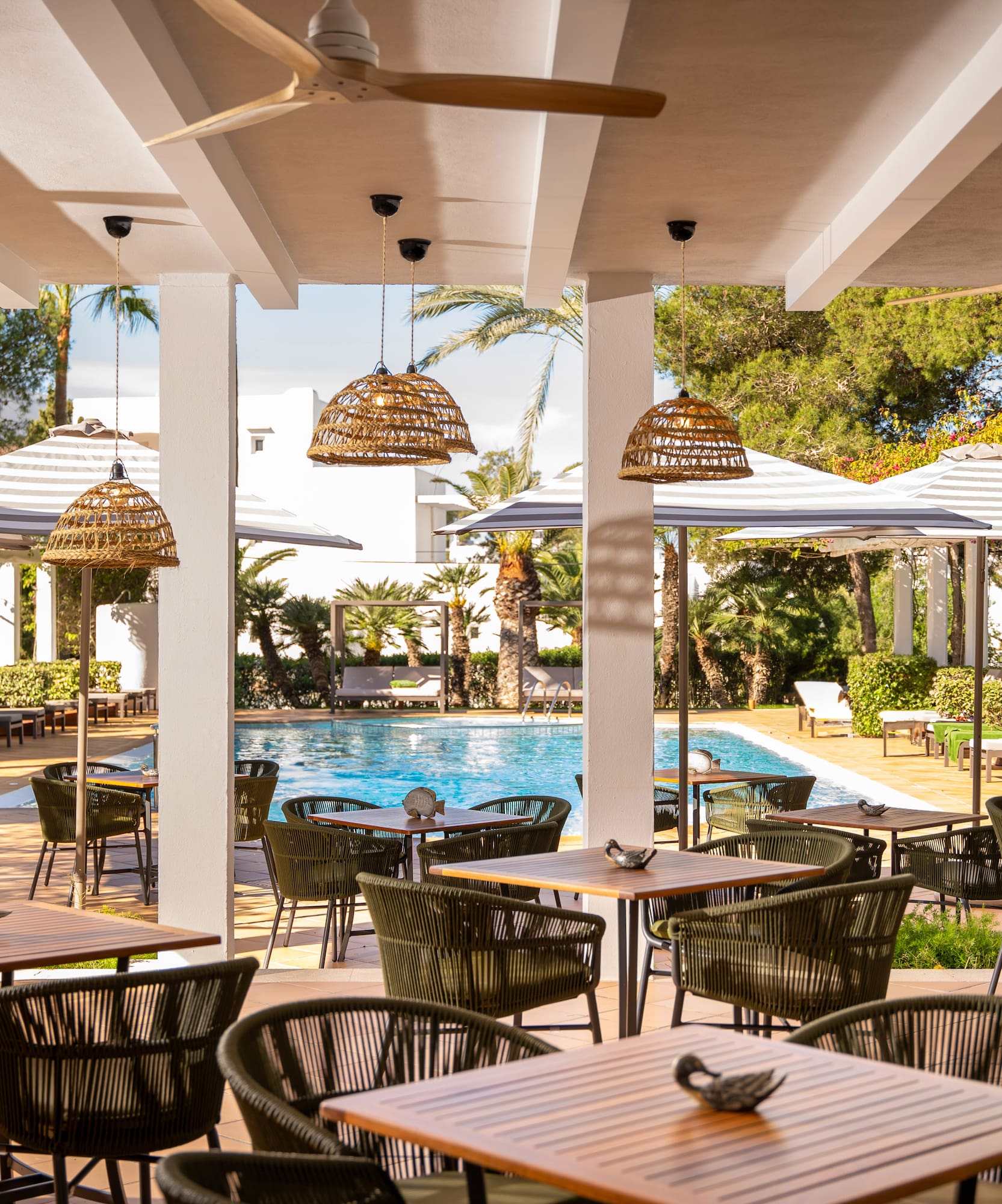 a pool with tables and chairs