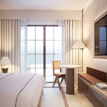 a room with a bed and a tv