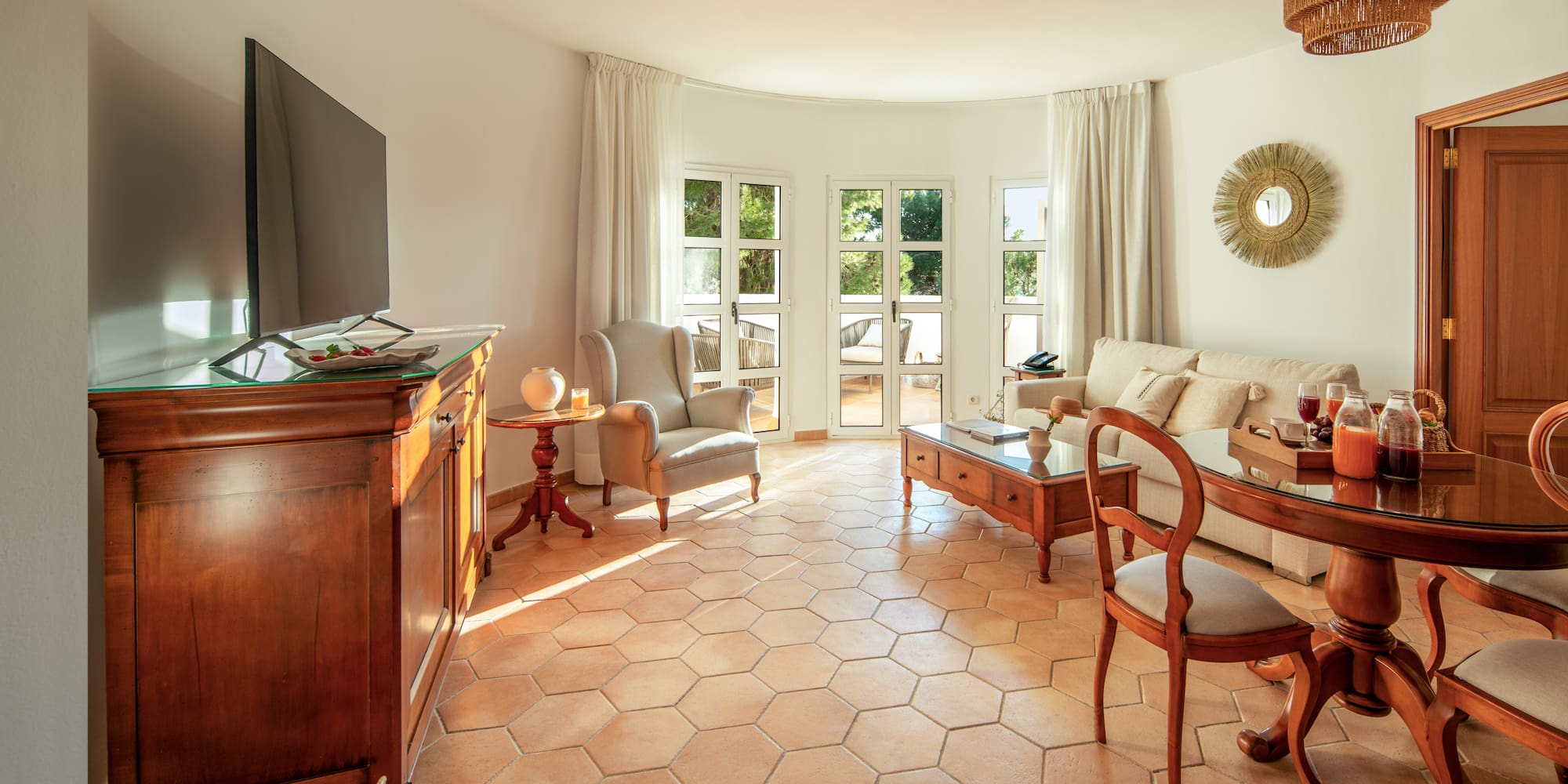 a living room with a television and furniture