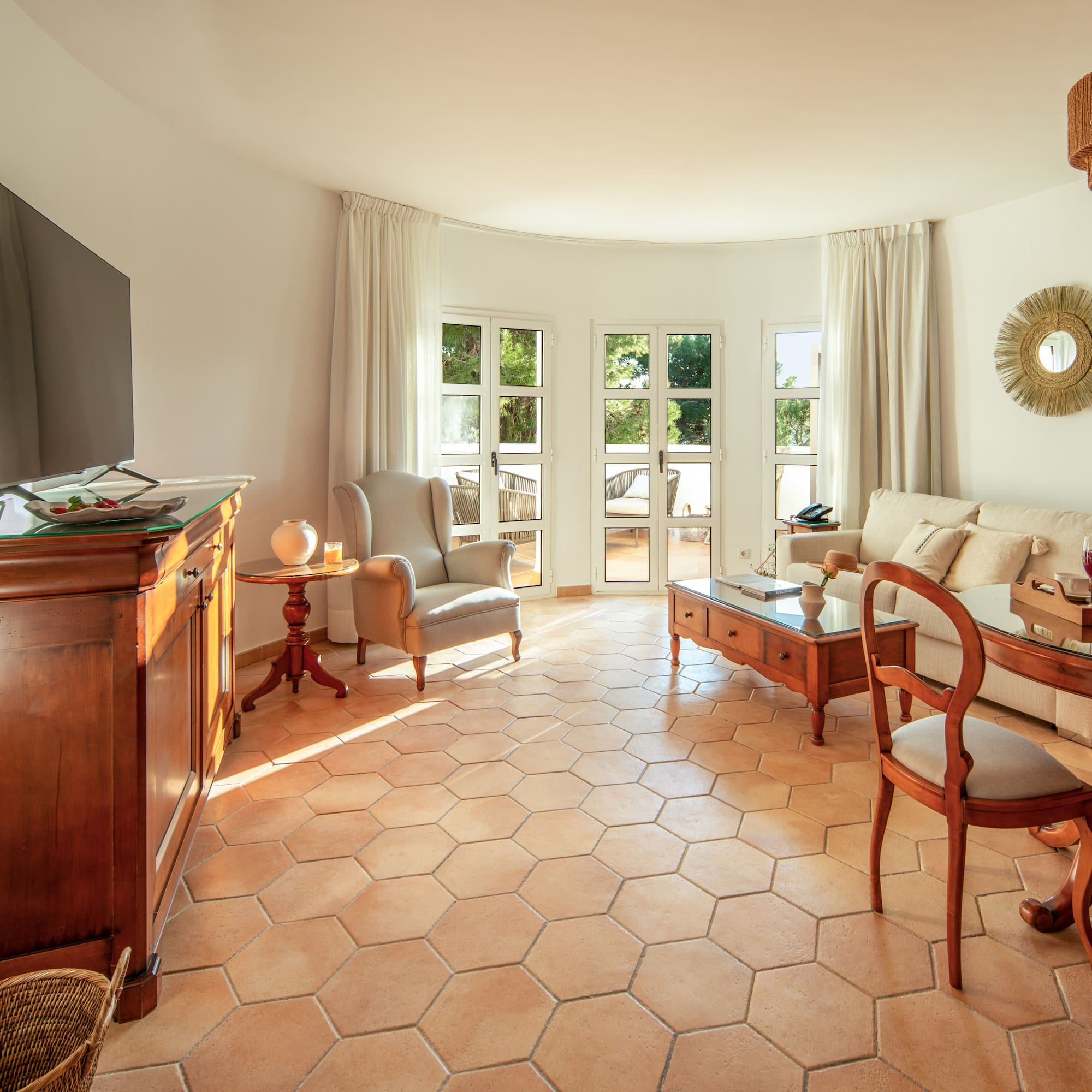 a living room with a television and furniture