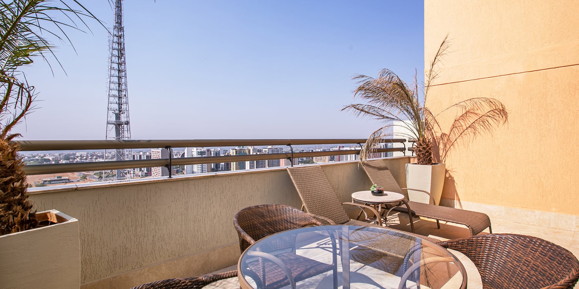 a patio with a table and chairs