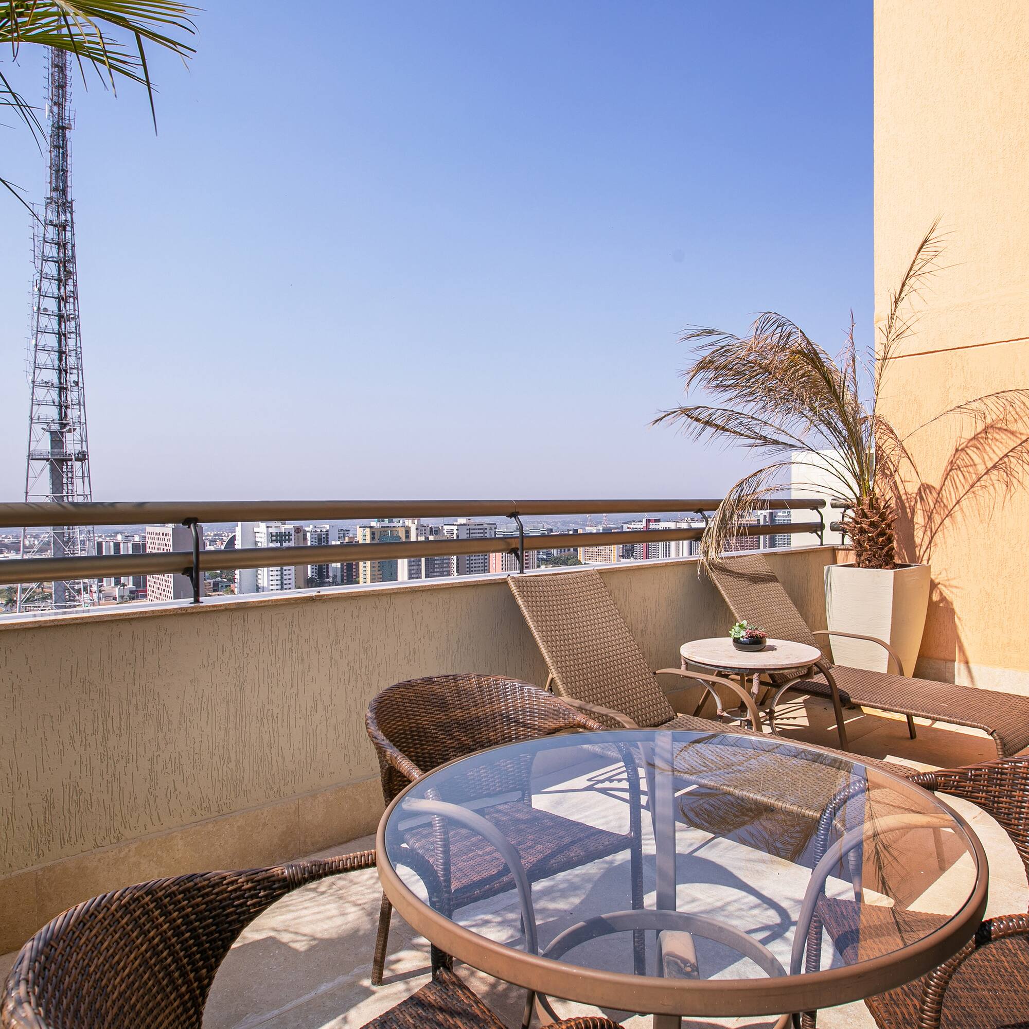 a patio with a table and chairs