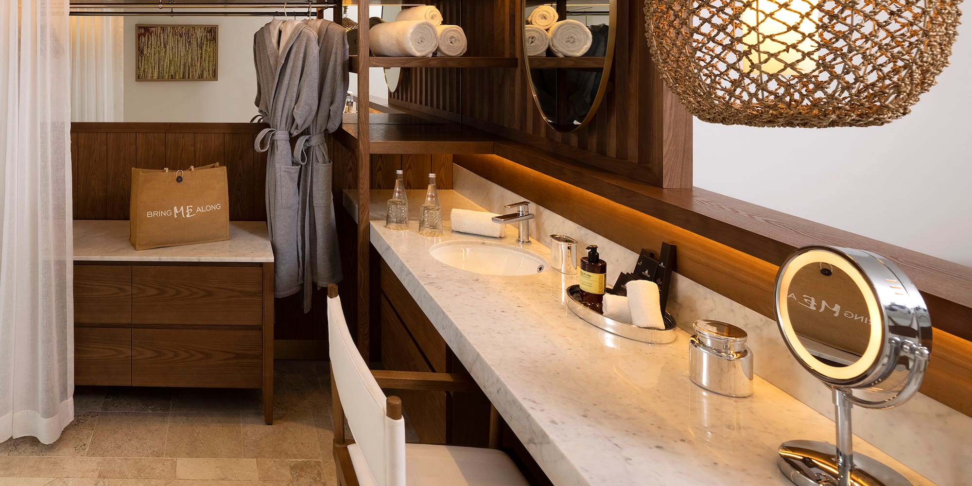 a bathroom with a mirror and towels