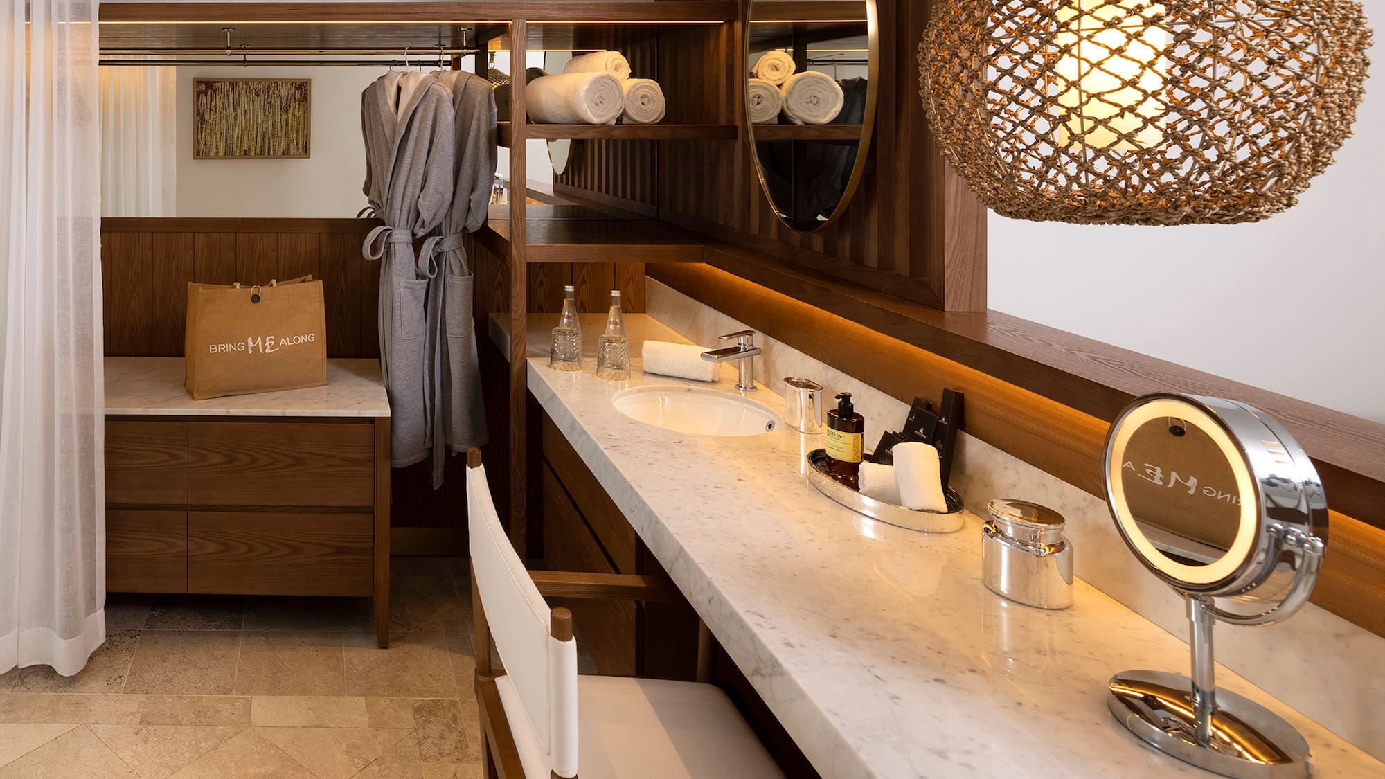 a bathroom with a mirror and towels