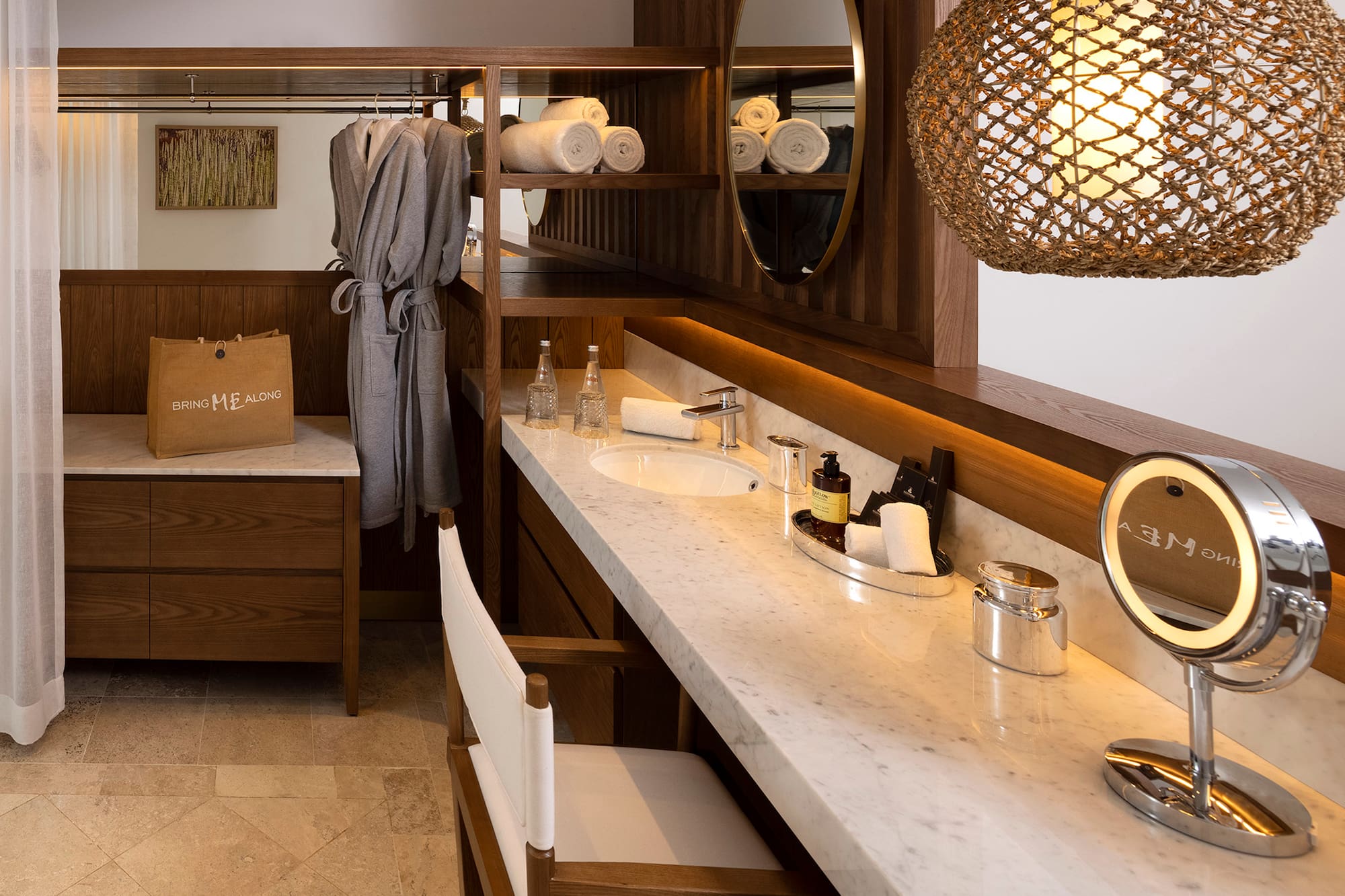 a bathroom with a mirror and towels