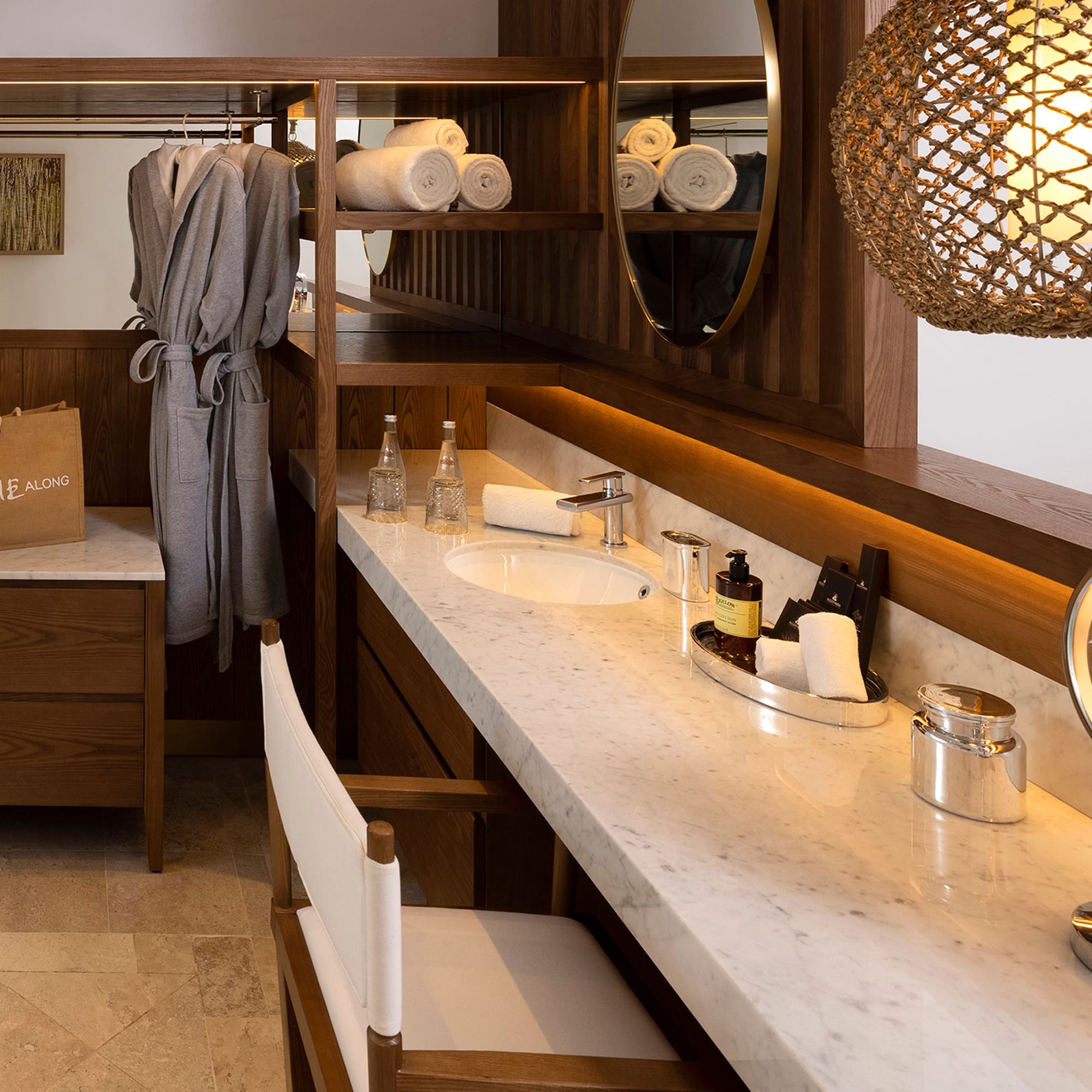 a bathroom with a mirror and towels