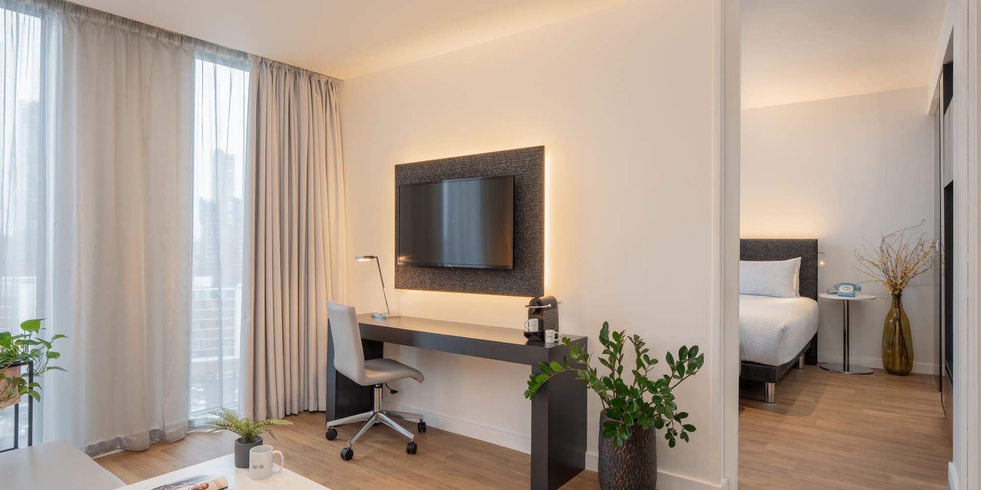 a room with a tv and a table