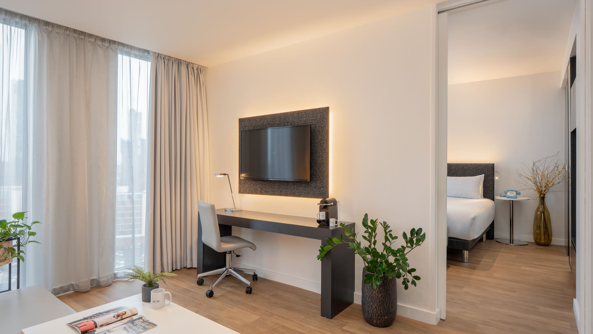 a room with a tv and a table