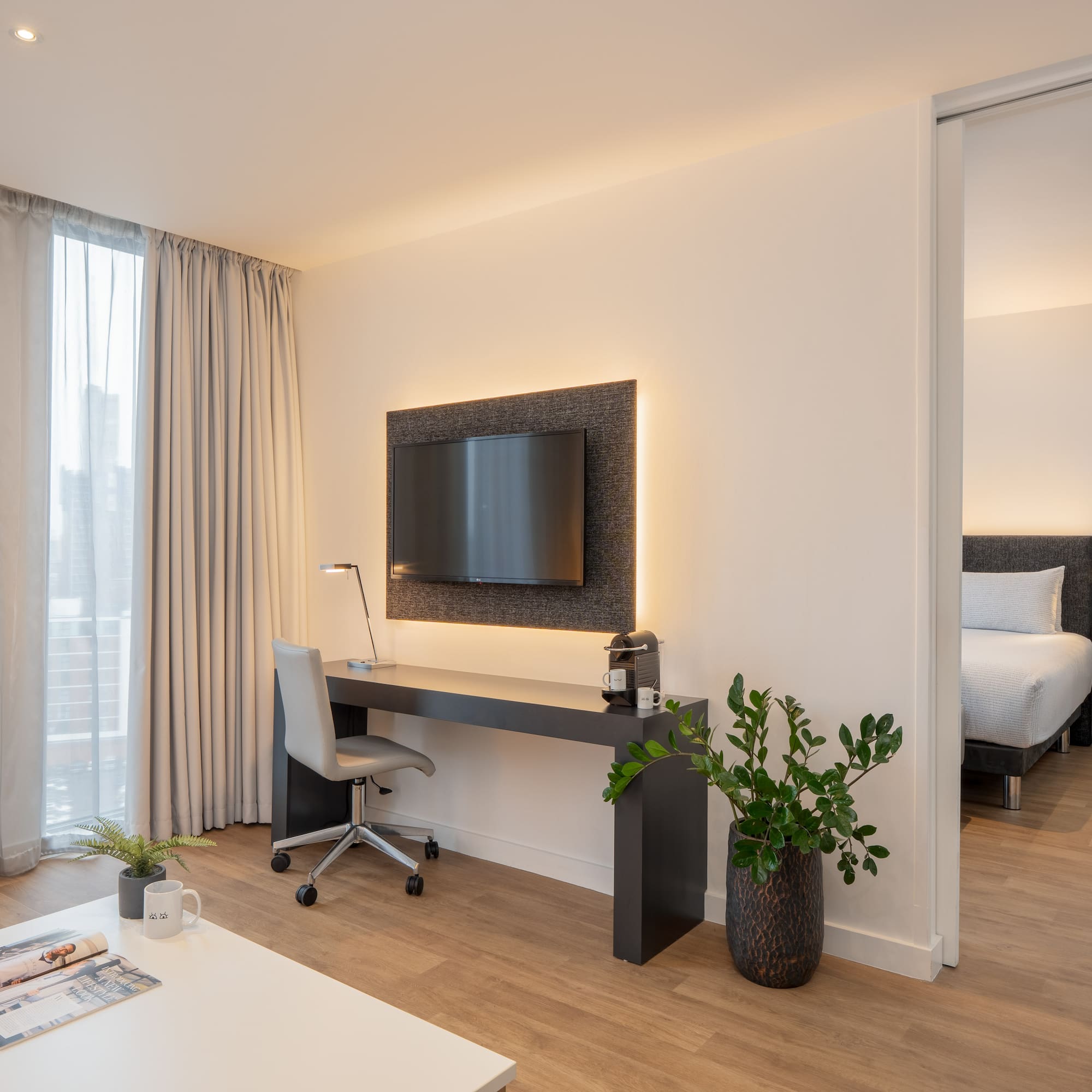 a room with a tv and a table