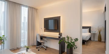 a room with a tv and a table