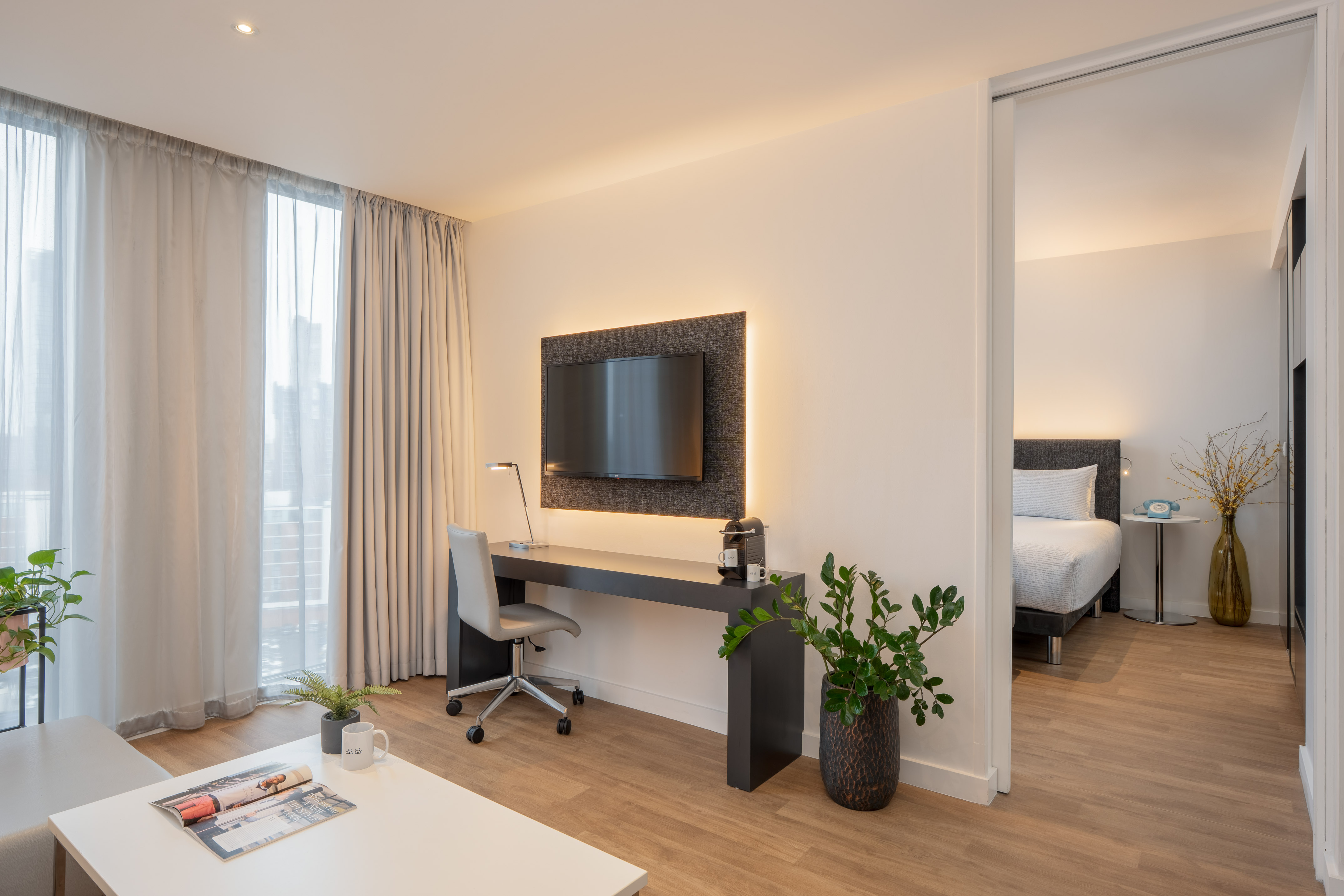 a room with a tv and a table