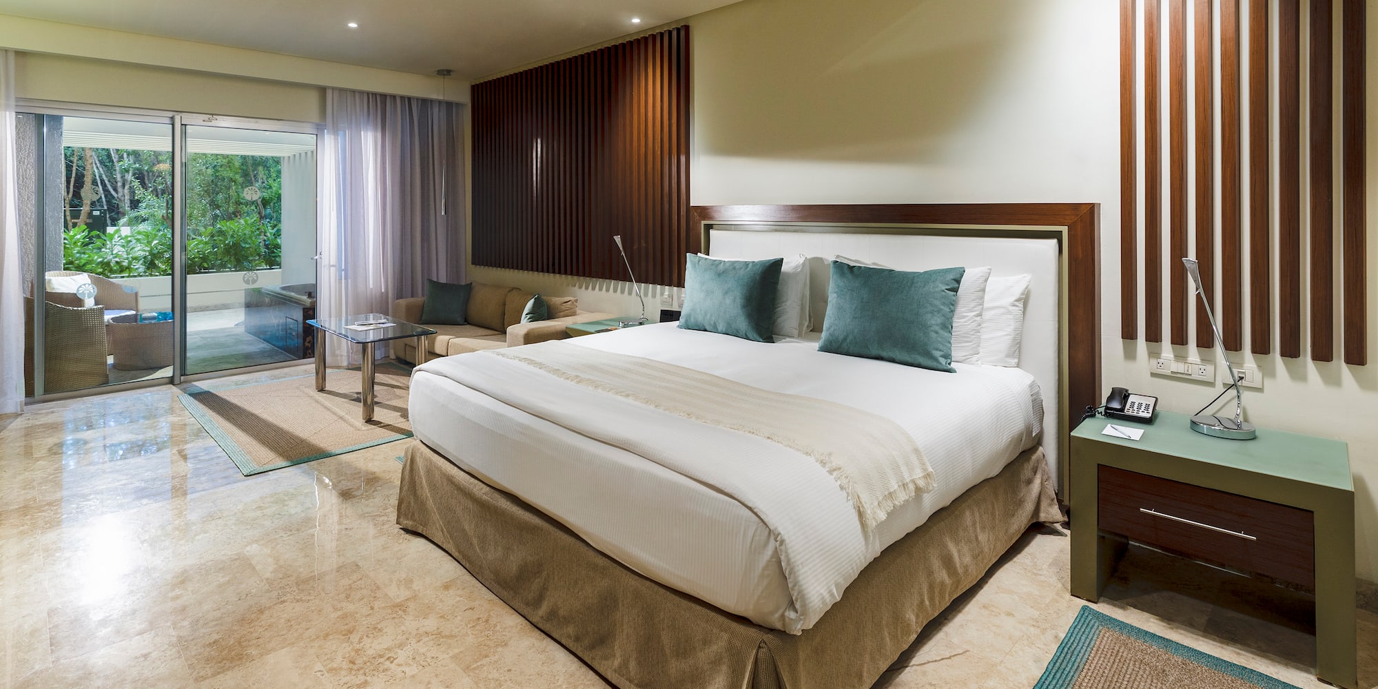 a bedroom with a glass door and a glass door