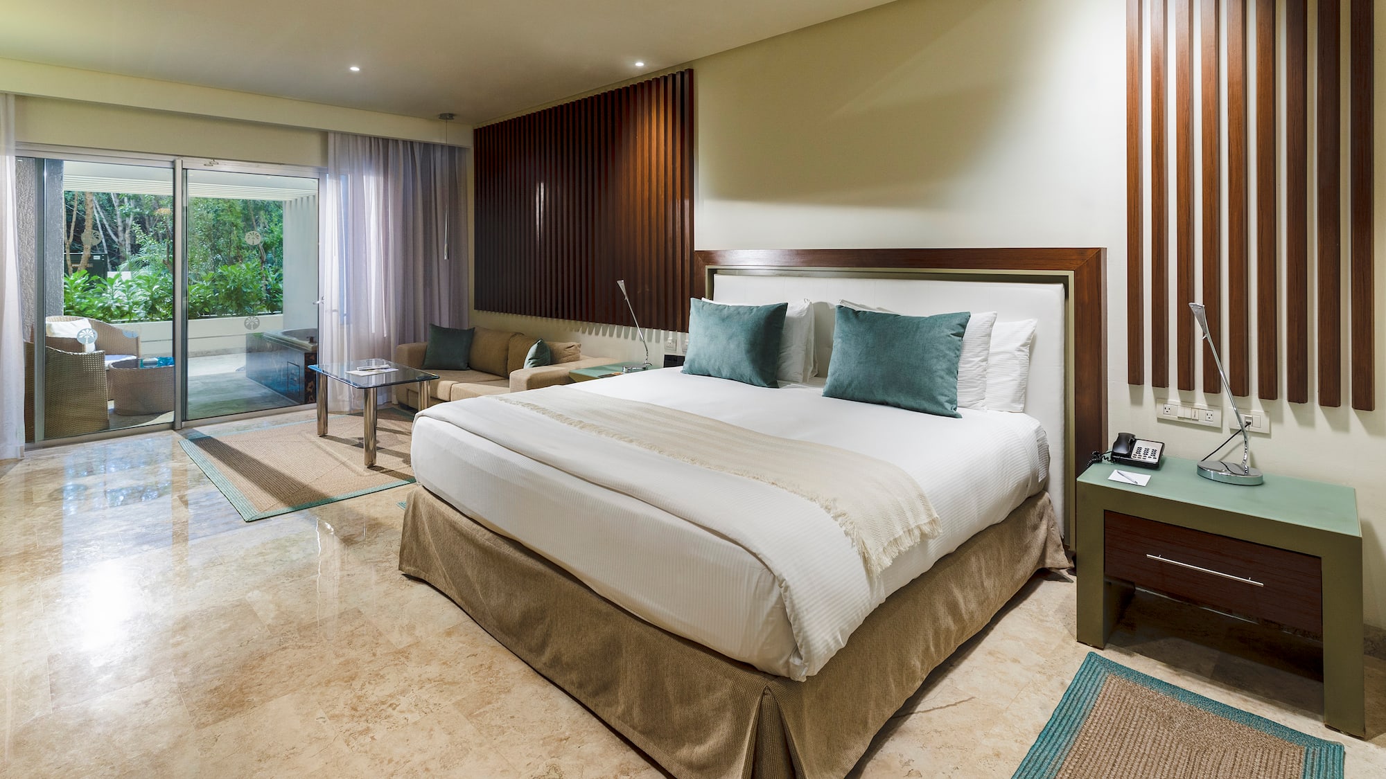 a bedroom with a glass door and a glass door