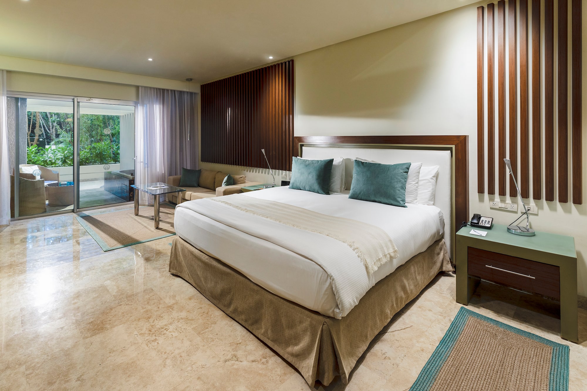 a bedroom with a glass door and a glass door