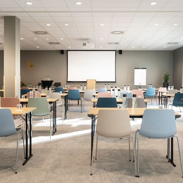 a room with tables and chairs